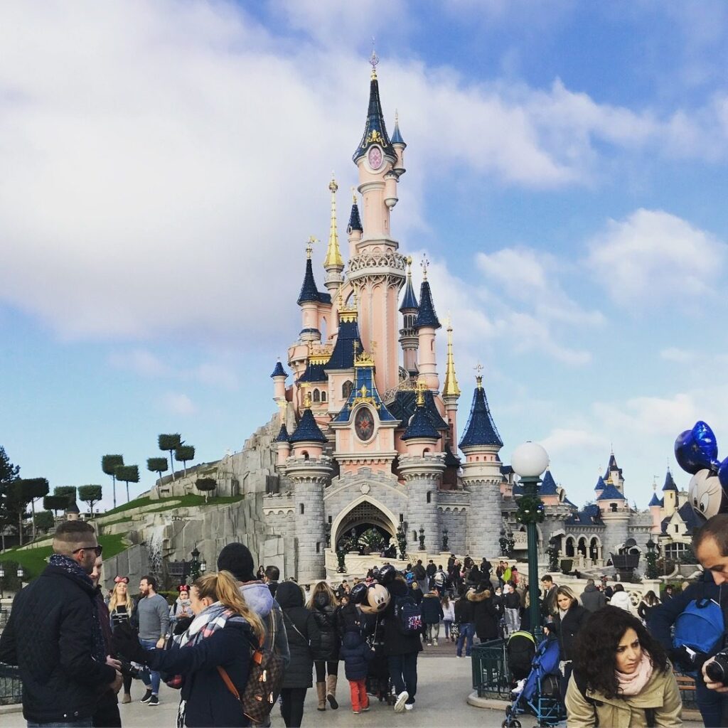 Sleeping Beauty's Castle at Disneyland Paris draws crowds of visitors in France.